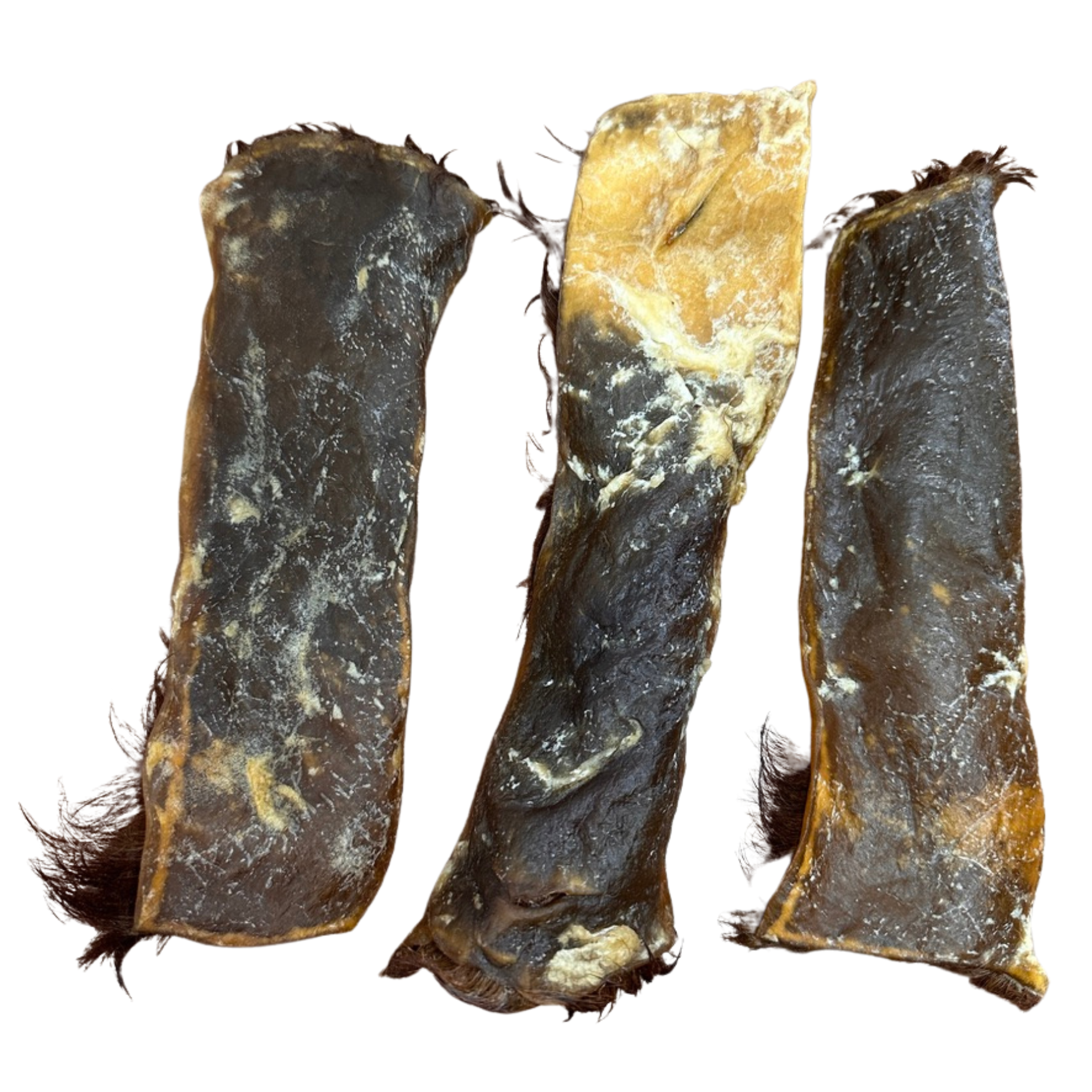 Three pieces of dried natural cow hide on a white background